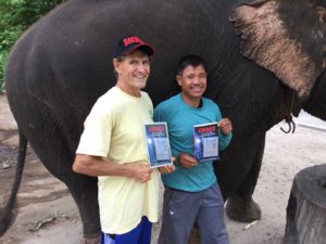 Dan Tito Davis Gringo Standing Next to Elephant in Northern Thailand